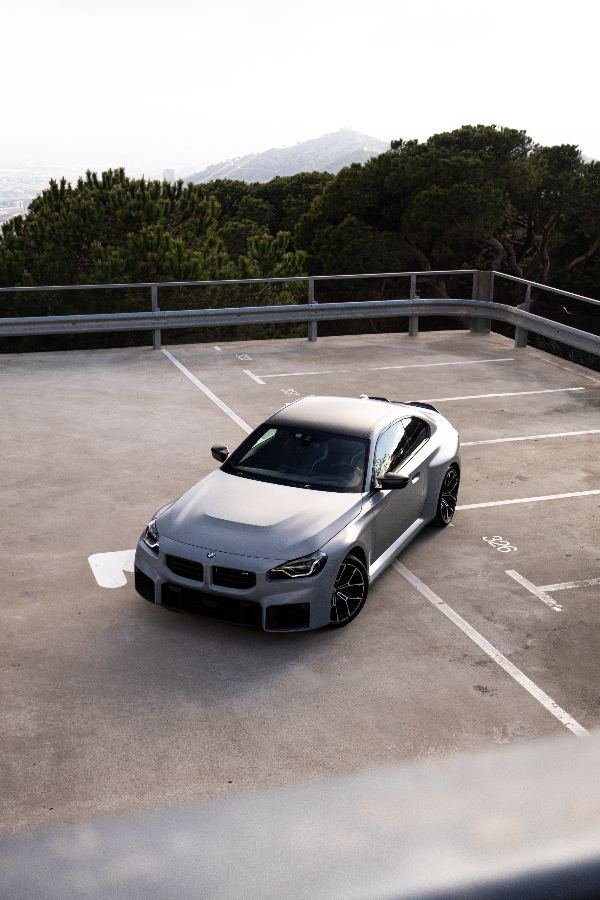 BMW M2 in frozen grey on a rooftop parking deck