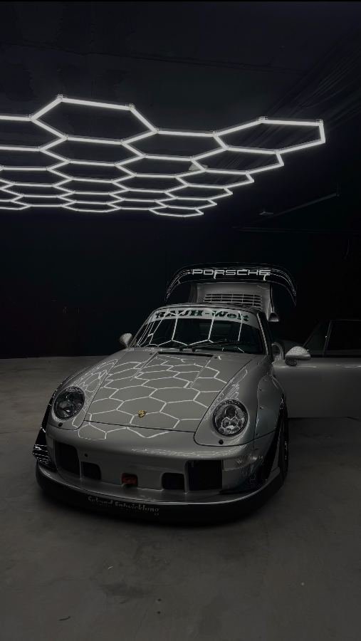 RWB Porsche 993 front three-quarter under hexagon studio lights