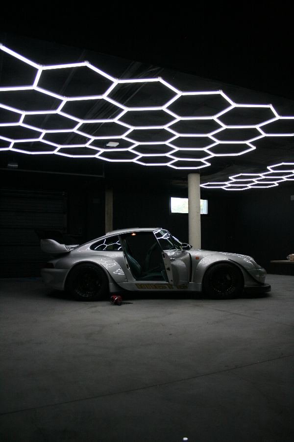 RWB Porsche 993 side profile under hexagon lights